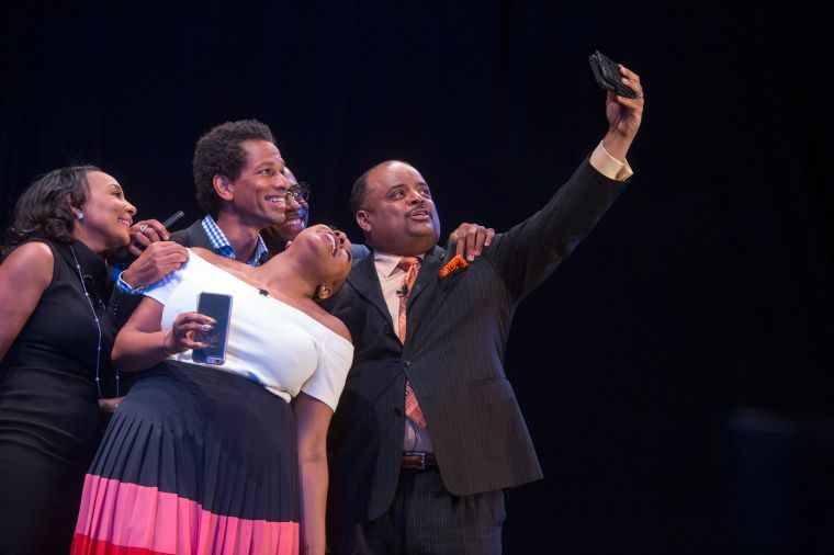 The panelists pose for a group selfie
