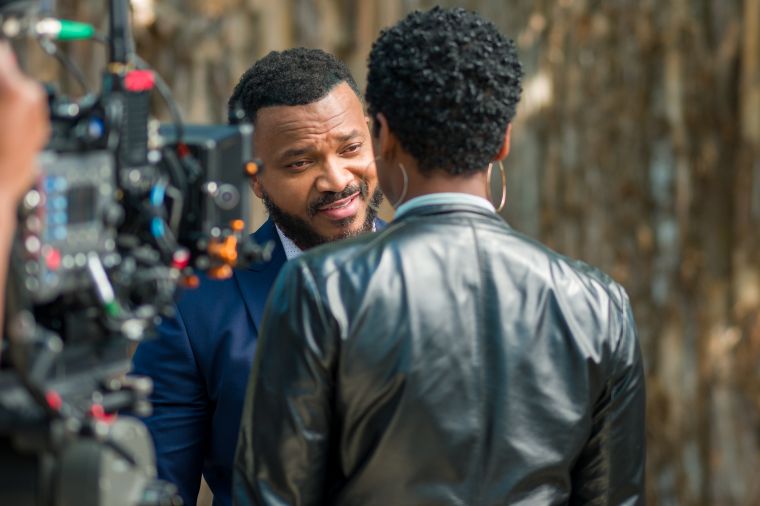 Dwayne Boyd as Cpt Michael Archer & Vicky Jeudy as Rochelle Sellers on the set of Stranger Next Door