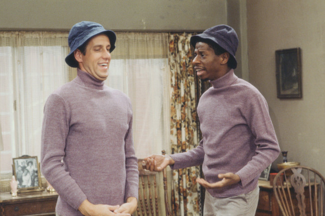 American actor Jimmie Walker (as J.J. Evans Jr) (right) reacts with concern to actor Dennis Howard (as 'White J.J.), dressed similarly to Walker, in a scene from an episode of the television series 'Good Times' entitled 'I Had a Dream,' Los Angeles, California, 1978. The episode was originally broadcast on January 30, 1978. (Photo by CBS Photo Archive/Getty Images)
