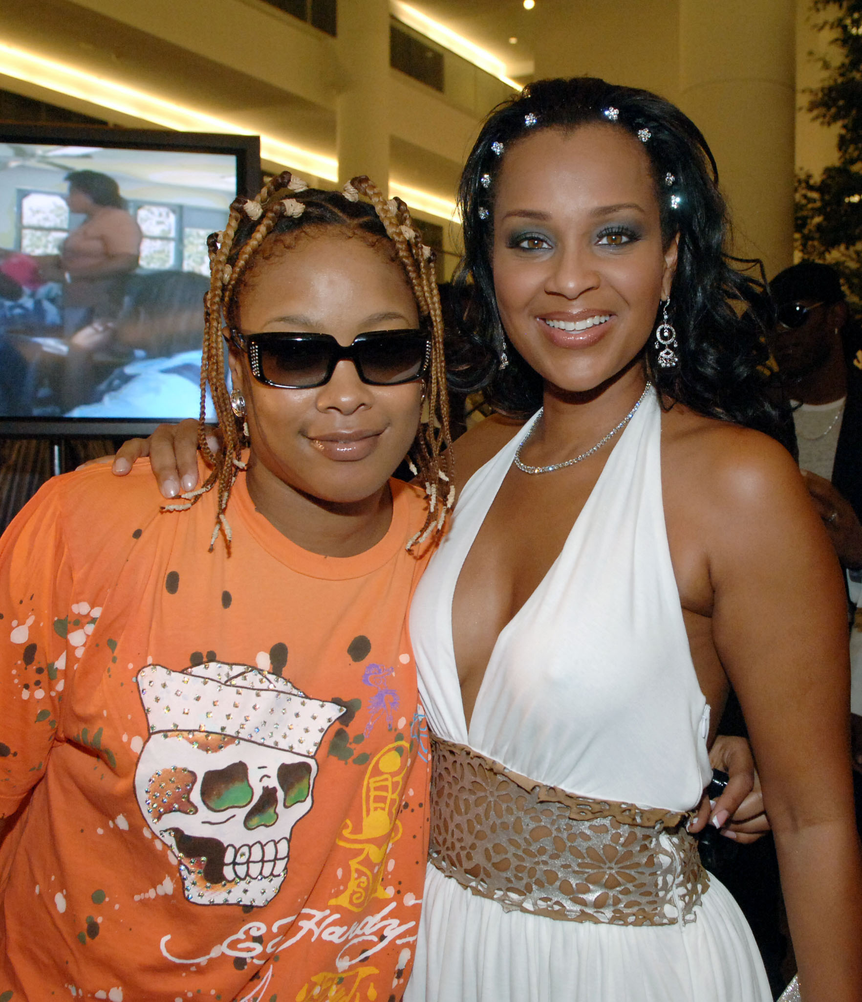 Rapper Da Brat (r), her sister actress Lisa Raye (middle), & her